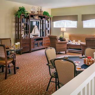 A cozy living room with comfortable seating and elegant decor.