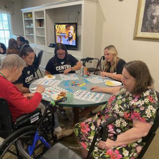 Residents enjoying a lively game of bingo together at the community center.