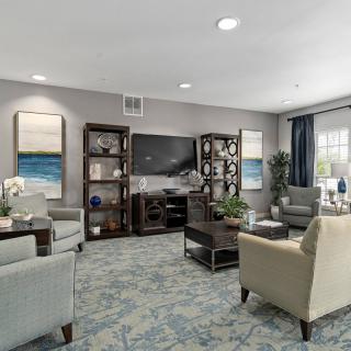 A modern living room with comfortable seating and elegant decor.