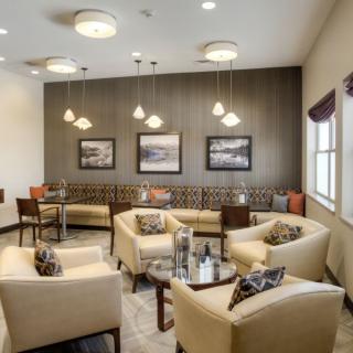 A modern waiting room with comfortable seating and stylish decor.