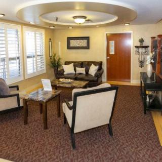 A cozy living room with comfortable seating and elegant decor.