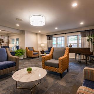 A modern lounge area featuring comfortable seating, stylish decor, and a welcoming atmosphere.