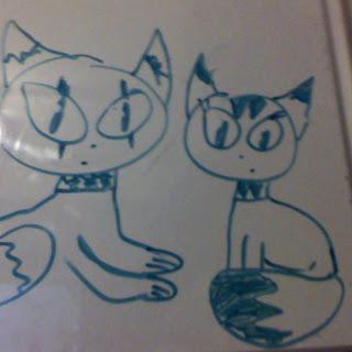 A playful drawing of two cartoon cats.