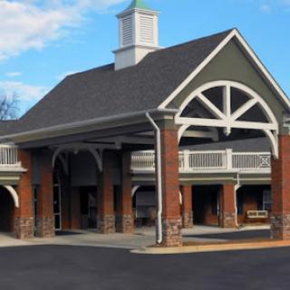 A beautifully designed entrance of a building with distinctive architectural features.