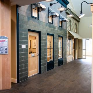 A modern office corridor with unique architectural elements.