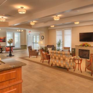 A modern living room with stylish furniture and a cozy fireplace.