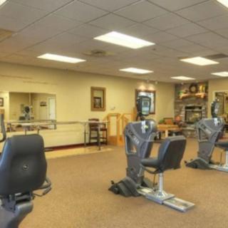 A spacious gym with stationary bikes and fitness equipment.