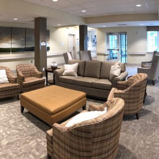 A cozy living room with modern furniture and neutral tones.
