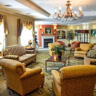 A cozy living room with comfortable seating and elegant decor.