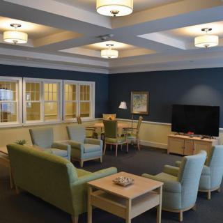 A cozy living room with comfortable seating and a television.