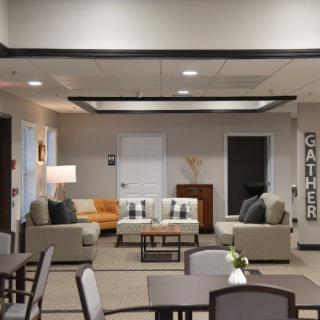A modern and cozy living room with comfortable seating and stylish decor.