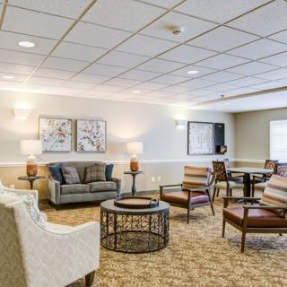 A cozy living room with a comfortable seating arrangement and soft lighting.