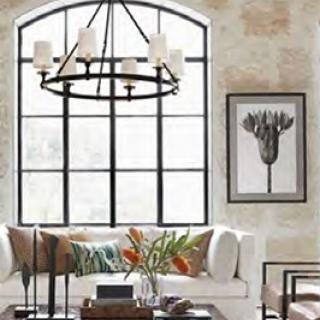 A beautifully designed living room showcasing modern decor with a focus on natural light and elegant furnishings.