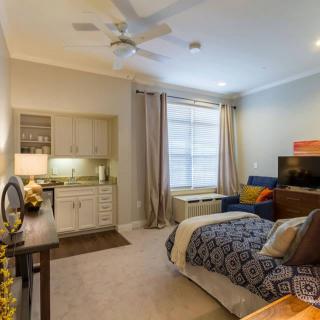 A modern bedroom with stylish decor and comfortable furniture.