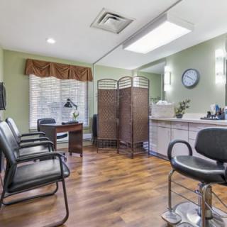 A well-organized salon space with a waiting area and hairdressing station.