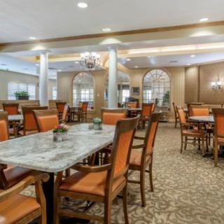 Elegant dining area with neatly arranged tables and chairs.