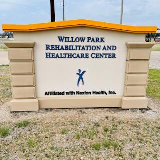 Sign for Willow Park Rehabilitation and Healthcare Center, indicating healthcare services available.