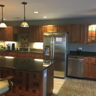 A modern kitchen featuring sleek appliances, elegant cabinetry, and stylish lighting.