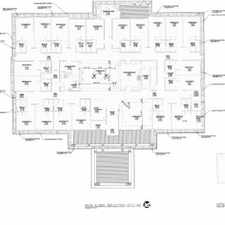 An architectural floor plan illustrating the layout and design of a building with rooms and measurements.