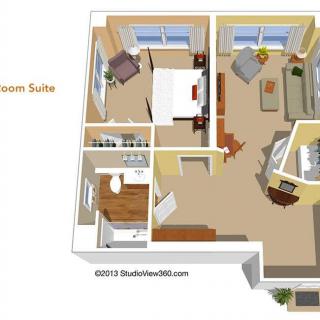 3D floor plan of a one-room suite with a bedroom, living area, and bathroom.