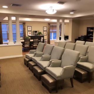 A cozy home theater with comfortable seating arrangements and a warm, inviting interior.