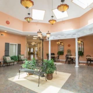 A bright atrium with elegant furnishings and an abundance of natural light.