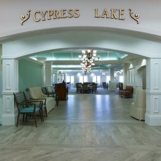 Elegant lobby entrance with seating and chandelier at Cypress Lake.