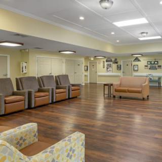 A spacious waiting area featuring comfortable seating and modern interior design.