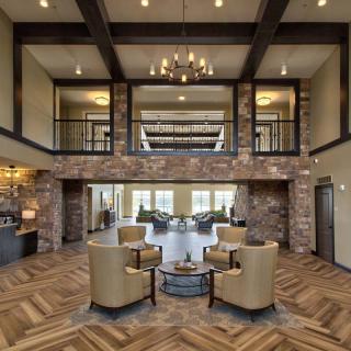 A modern lobby with a cozy seating area and elegant decor.