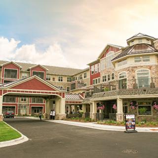 A beautiful residential community building showcasing modern architecture and inviting outdoor spaces.