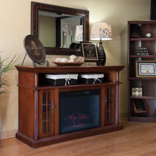 A stylish wooden furniture piece featuring a built-in electric fireplace, accompanied by a mirror and decorative elements, perfect for enhancing the living room ambiance.