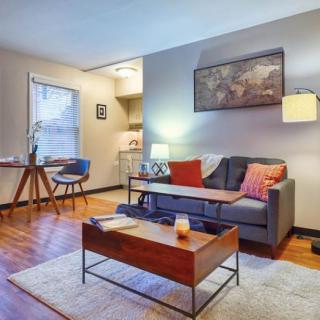 A cozy and modern living room with warm lighting and stylish decor.