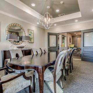 A well-designed dining room with elegant furniture and contemporary lighting.