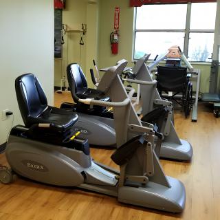 A small fitness room with stationary exercise bikes.