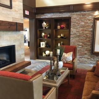 A cozy living room with a fireplace and elegant decor.