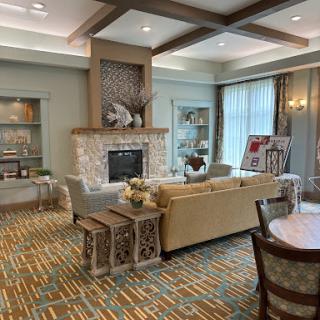 A stylish and comfortable living room featuring a cozy fireplace and modern decor.