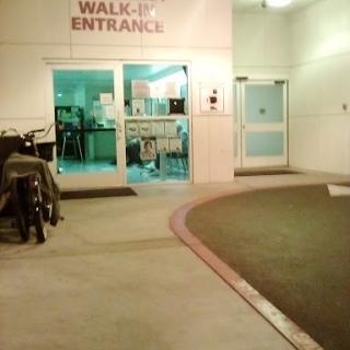 Walk-up entrance to a building, illuminated at night.