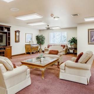 A cozy living room with comfortable seating and elegant decor.