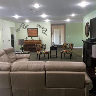 A spacious living room with comfortable seating and stylish decor.
