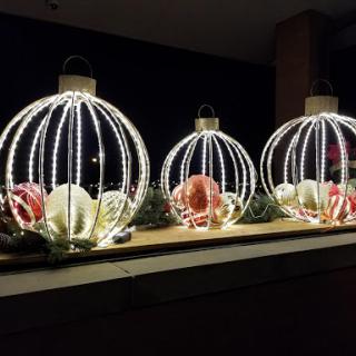 Beautifully lit holiday decorations create a warm and inviting atmosphere at night.