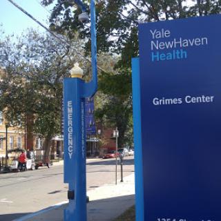 Sign for the Yale New Haven Health Games Center, located outdoors.