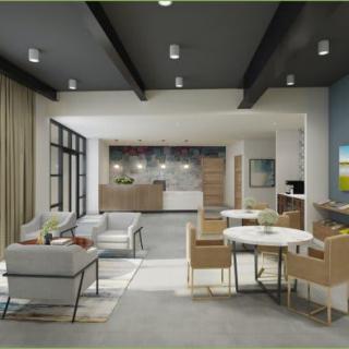 A modern open-plan living space featuring a comfortable seating area and a sleek kitchen.