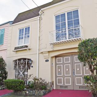 A residential house with a classic architectural design and well-maintained garden.