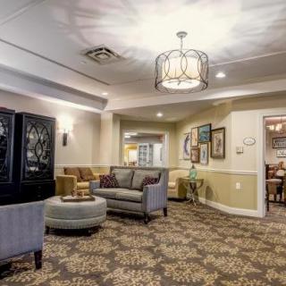 A cozy lounge area with comfortable seating and elegant lighting.