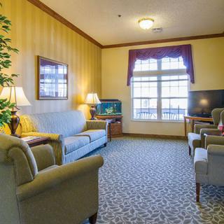 A cozy living room with comfortable seating and natural light.