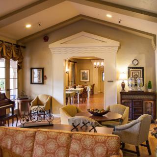 A cozy and elegantly furnished traditional living room.