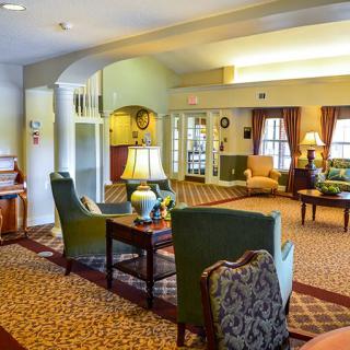 A cozy lobby interior with comfortable seating and warm lighting.