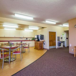 A spacious kitchen and dining area with modern appliances and ample seating.
