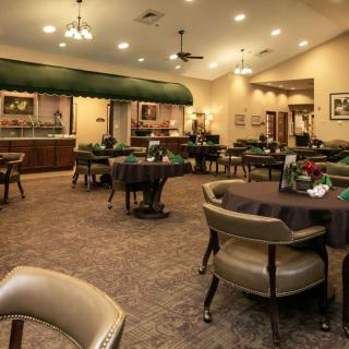 A cozy restaurant interior with neatly arranged tables and chairs.