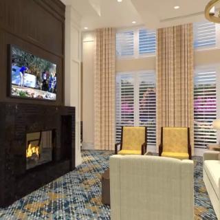A cozy living room featuring a fireplace and a television, with stylish furniture and decor.